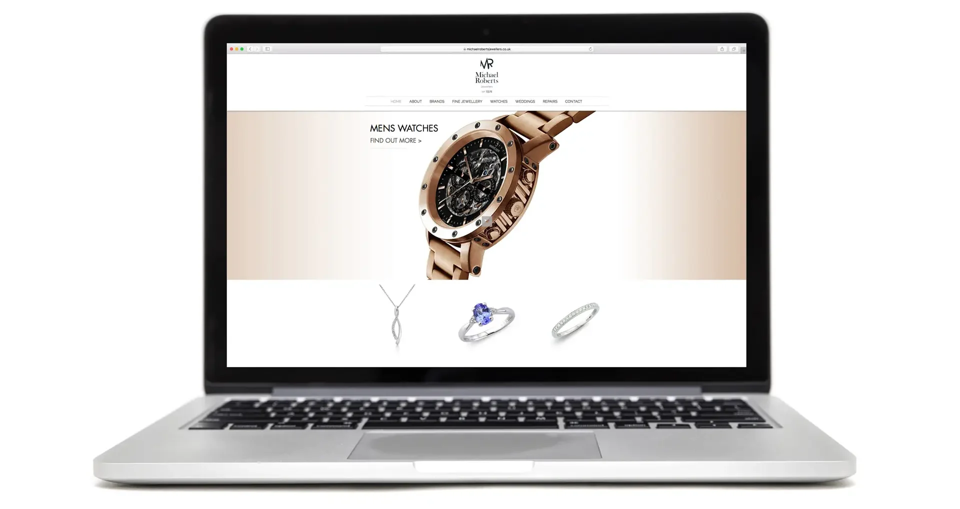 Michael Roberts website design displayed on a laptop