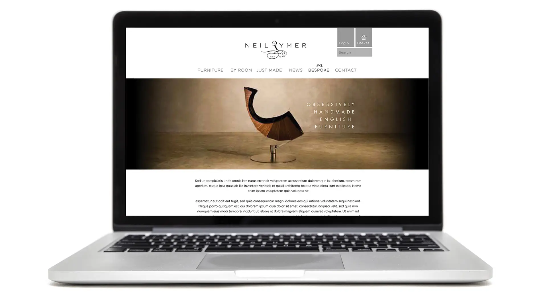 Neil Rymer website displayed on a laptop