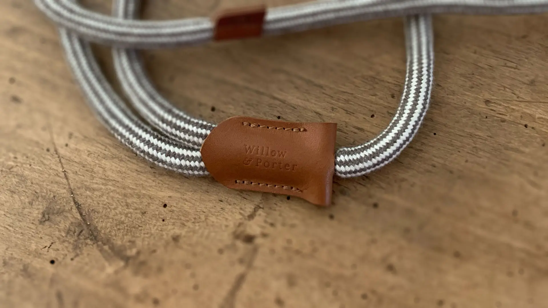 Willow & Porter Logo embossed onto a leather dog lead tag